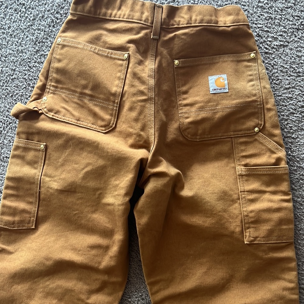 Carhartt reinforced tan work pants size 26 in excellent condition